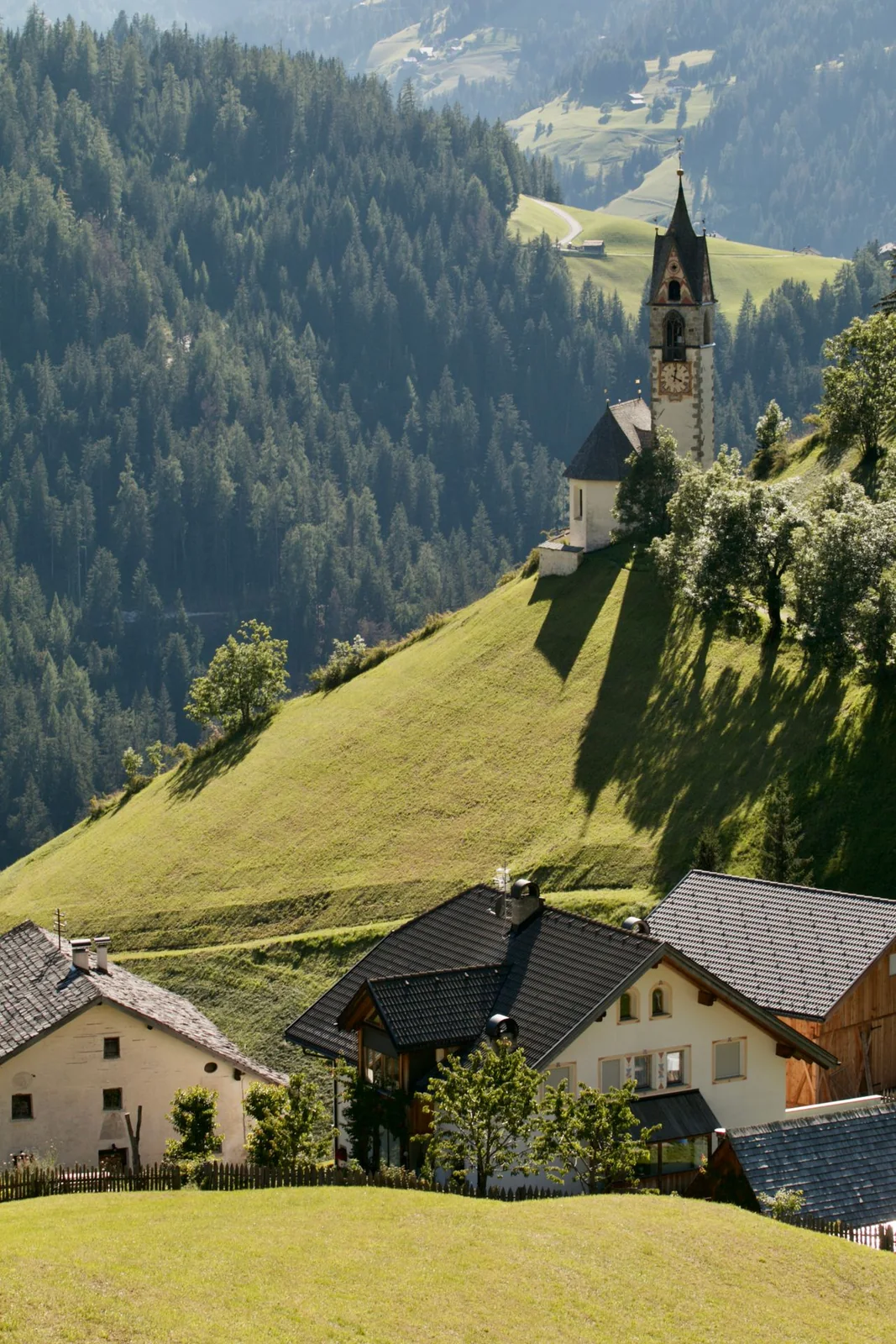 Small church in a green Alpine valley