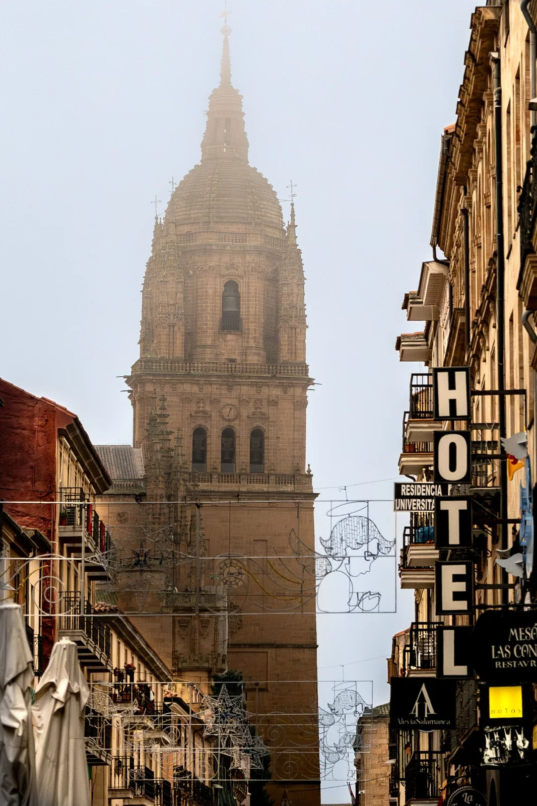 Historic European city street and cathedral tower